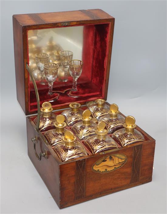 A 19th century inlaid liqueur casket with gilded bottles and glasses